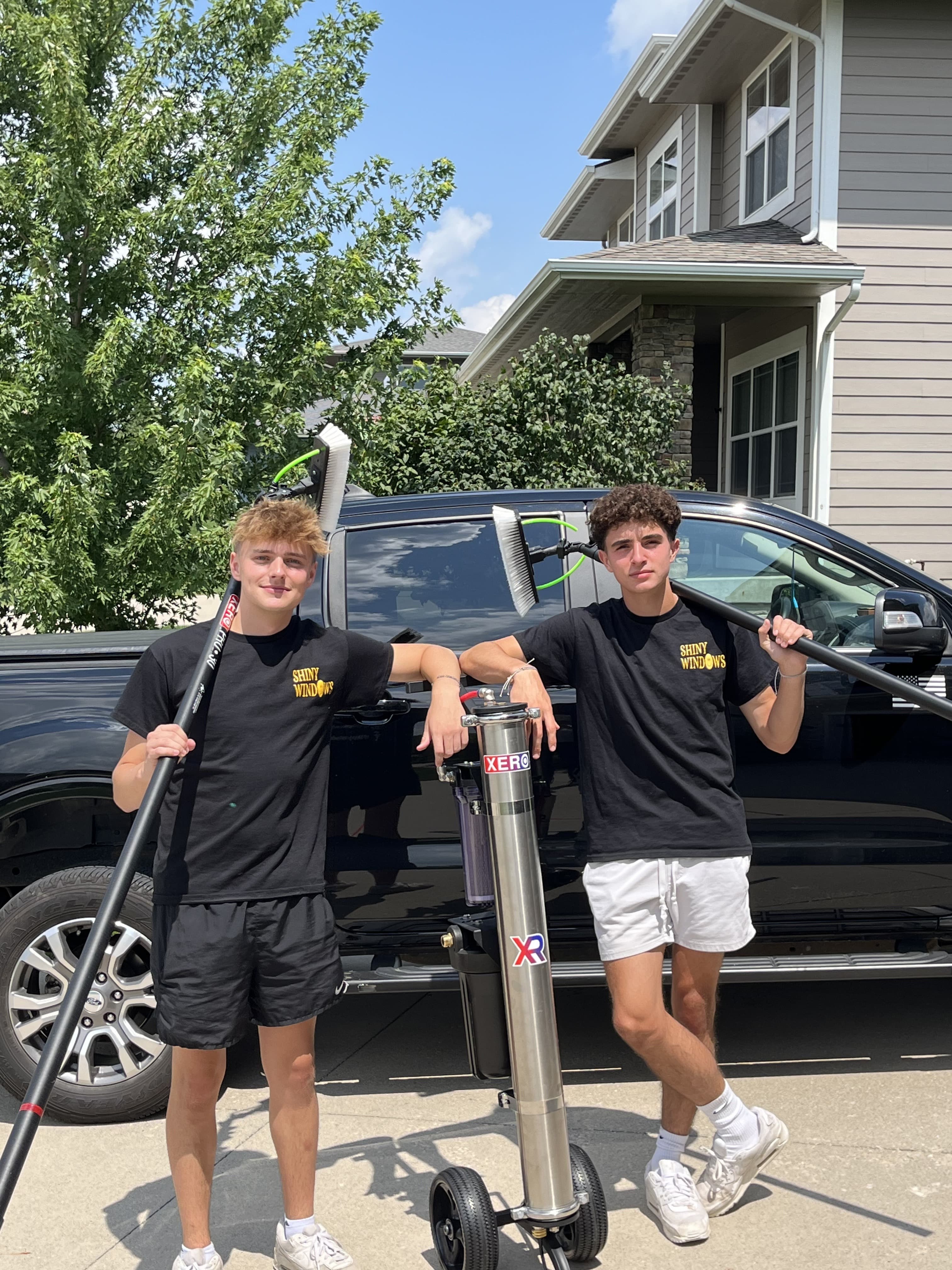 The Window Boss crew in front of the work truck, ready to head out to a job in the Des Moines metro.